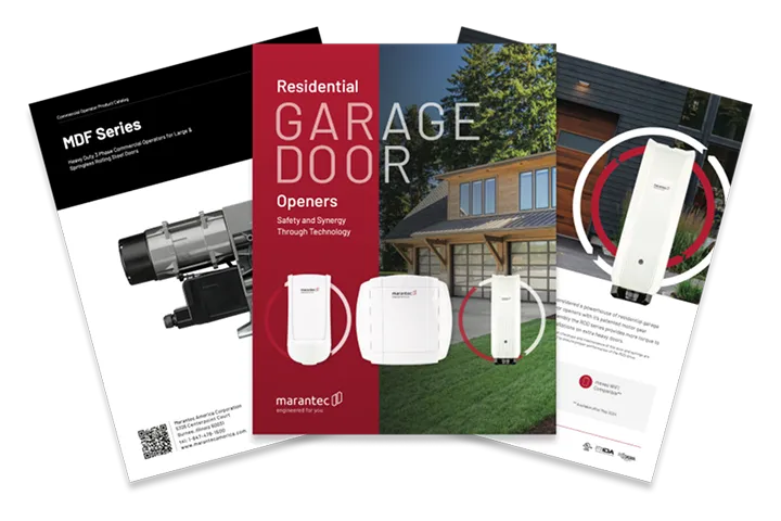 Stack of various garage door manuals and documentation.